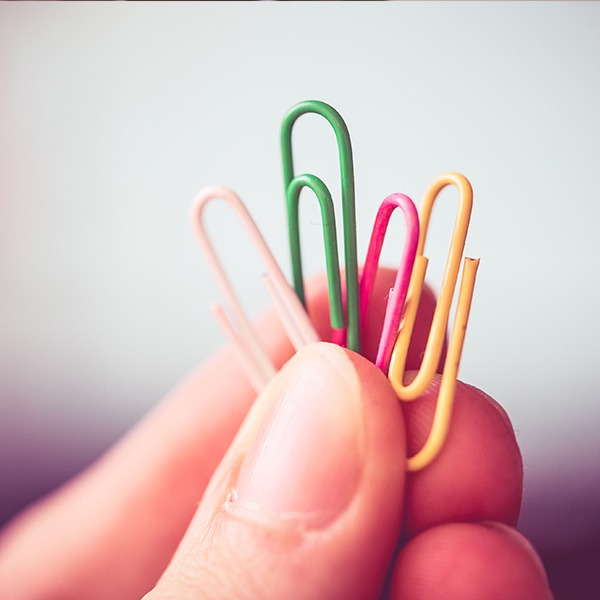 Hand holding Paperclips