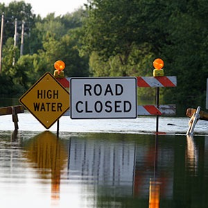 Flood Program Flooded Road with Closed Signs