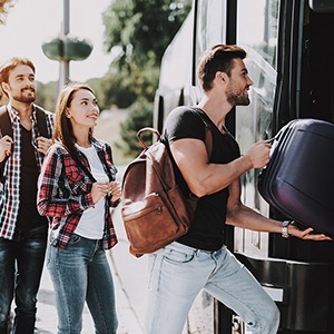 People getting inside of travel bus