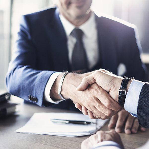 Business men shaking hands over a contract