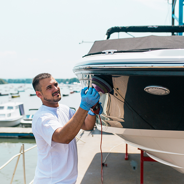 Person polishing boat yacht