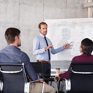 Man explaining benefits to group of people