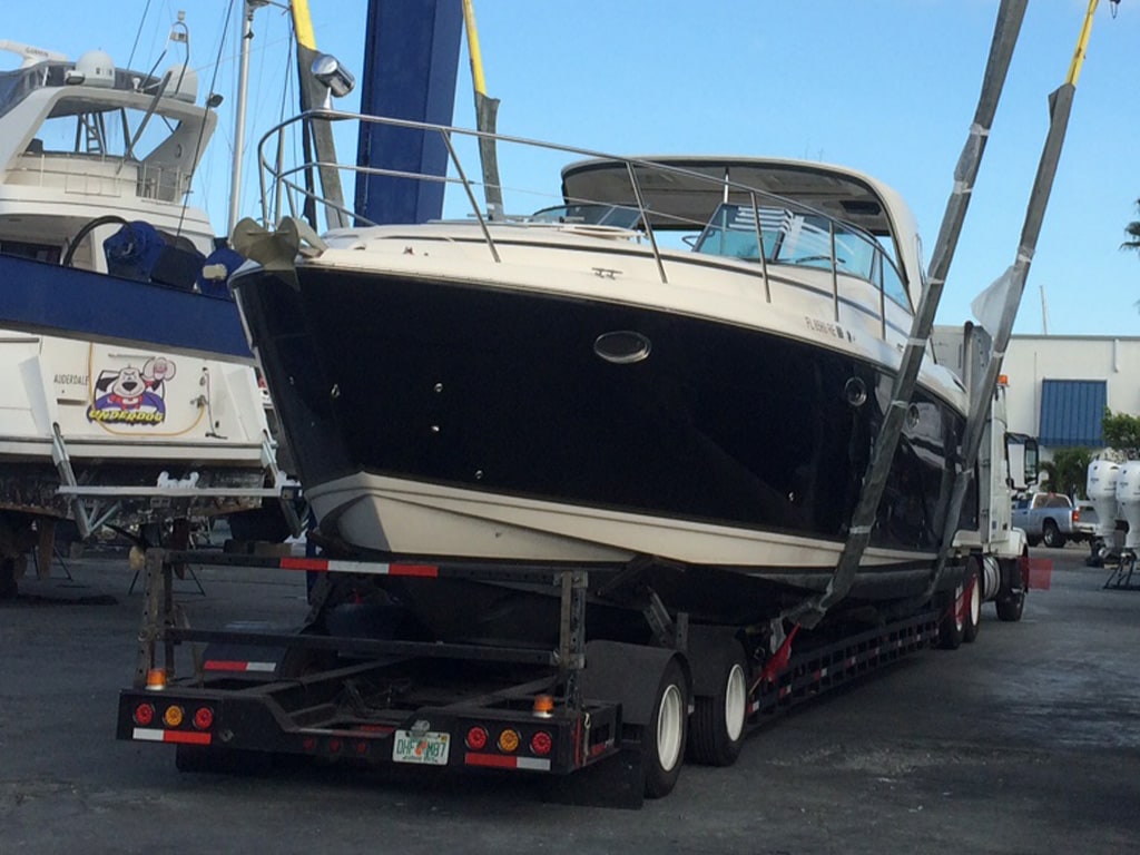 Flat truck carrying boat