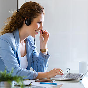 Woman talking to a customer over headset