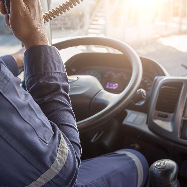 Driver sending a communication message in his truck