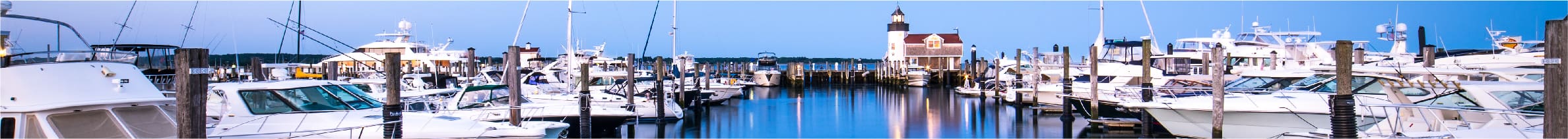 Line of yachts in boat dock